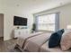 Bright main bedroom with a large window, curtains, and plush bedding for ultimate comfort at 3409 Catalan Aly, Decatur, GA 30032