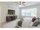 Cozy main bedroom with a large window, stylish dresser, and comfortable bed setting at 3409 Catalan Aly, Decatur, GA 30032