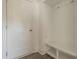 Neat mudroom with a built-in bench, storage cubbies, and a convenient coat closet at 3409 Catalan Aly, Decatur, GA 30032
