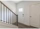 Elegant staircase featuring wood handrail, iron balusters, and sleek, modern design at 3409 Catalan Aly, Decatur, GA 30032