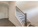 Modern staircase with sleek black railings and hardwood steps, in a bright interior setting at 3409 Catalan Aly, Decatur, GA 30032