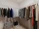 Walk-in closet with modern shelving and a variety of hanging clothes at 3409 Catalan Aly, Decatur, GA 30032