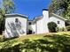 The backyard has a gentle slope and a classic white painted brick chimney at 6751 Davidson Ct, Lithonia, GA 30058