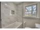 Bathroom featuring white marble tiled shower and tile flooring at 6751 Davidson Ct, Lithonia, GA 30058