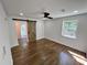 Bedroom with hardwood floors, barn door, and ample natural light from the window at 6751 Davidson Ct, Lithonia, GA 30058