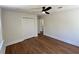 Bedroom boasts hardwood floors, fresh paint, and an ample closet space at 6751 Davidson Ct, Lithonia, GA 30058