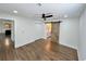 Bedroom with hardwood floors, ceiling fan, closet, and barn door leading to the bathroom at 6751 Davidson Ct, Lithonia, GA 30058