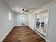 Spacious bonus room featuring french doors, vinyl floors, and ample natural light at 6751 Davidson Ct, Lithonia, GA 30058