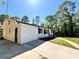 Home exterior view featuring a concrete driveway and white siding at 6751 Davidson Ct, Lithonia, GA 30058