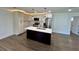 Modern kitchen with an island, stainless steel appliances, and plenty of cabinet space at 6751 Davidson Ct, Lithonia, GA 30058