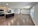 Spacious open floor plan with hardwood floors connects the modern kitchen to the expansive living area at 6751 Davidson Ct, Lithonia, GA 30058