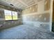 A blank canvas bedroom featuring unfinished drywall, a bright window, and potential for a cozy retreat at 3375 Hillshire Dr, Cumming, GA 30028
