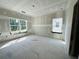 Bedroom showing drywall and large windows, ready for the next construction phase at 3375 Hillshire Dr, Cumming, GA 30028