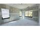 A bedroom during construction showing drywall, windows, and an unfinished floor at 3375 Hillshire Dr, Cumming, GA 30028