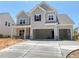 Beautiful two-story home with a three-car garage and craftsman-style details, offering ample parking at 3375 Hillshire Dr, Cumming, GA 30028