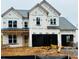 New construction home featuring a two-car garage and traditional architecture, ready for customization at 3375 Hillshire Dr, Cumming, GA 30028