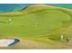 Scenic golf course view with green grass, sand bunker, and golfers playing at 3375 Hillshire Dr, Cumming, GA 30028