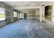Spacious unfinished living room showing space and layout with visible staircase at 3375 Hillshire Dr, Cumming, GA 30028