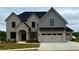 Charming two-story home with brick and siding, complemented by a well-manicured lawn at 4201 Hosch Reserve Dr, Buford, GA 30519