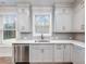 Gourmet kitchen with stainless steel appliances and light gray cabinets at 4201 Hosch Reserve Dr, Buford, GA 30519