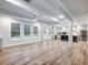 Bright, open living room with wood floors flows into the modern kitchen at 4201 Hosch Reserve Dr, Buford, GA 30519