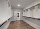 Walk-in closet with lots of shelving and racks with an entry hallway beyond at 4201 Hosch Reserve Dr, Buford, GA 30519