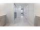 Bathroom showcasing a hallway view, a glass-enclosed shower, and modern vanities at 4201 Hosch Reserve Dr, Buford, GA 30519