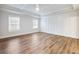 Large primary bedroom features wainscoting and coffered ceilings at 4201 Hosch Reserve Dr, Buford, GA 30519