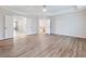 Spacious bedroom with tray ceilings, a ceiling fan, and doors to other areas of the home at 4201 Hosch Reserve Dr, Buford, GA 30519