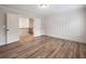 Stylish bedroom featuring decorative wall paneling and staircase access at 4201 Hosch Reserve Dr, Buford, GA 30519