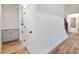 Hallway boasts a built-in storage cabinet and flows to staircase and bathroom at 4201 Hosch Reserve Dr, Buford, GA 30519