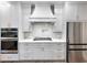Well-equipped kitchen features stainless steel appliances, custom cabinets, and gas cooktop at 4201 Hosch Reserve Dr, Buford, GA 30519
