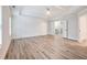 Spacious main bedroom features light wood flooring, wainscoting and an ensuite bathroom at 4201 Hosch Reserve Dr, Buford, GA 30519