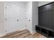 Entryway with built-in hall tree and bench seating at 4201 Hosch Reserve Dr, Buford, GA 30519