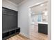 Mudroom features hall tree with bench seating and storage at 4201 Hosch Reserve Dr, Buford, GA 30519