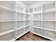 Spacious walk-in closet with ample shelving for optimal storage at 4201 Hosch Reserve Dr, Buford, GA 30519