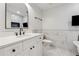 Modern bathroom featuring marble tile, a white vanity, and a fireplace at 705 Trickum Valley Dr, Woodstock, GA 30188