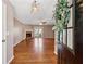 Inviting living room featuring hardwood floors, a cozy fireplace, and French doors offering a welcoming space at 705 Trickum Valley Dr, Woodstock, GA 30188