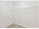 Empty walk-in closet offers ample storage with white wire shelving along the perimeter at 705 Trickum Valley Dr, Woodstock, GA 30188