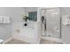 Bright bathroom featuring a soaking tub, and glass enclosed shower with a neutral color scheme at 1031 Ludwick Way, Lawrenceville, GA 30046