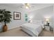 Bright bedroom features a neutral color scheme, large window, and closet at 1031 Ludwick Way, Lawrenceville, GA 30046