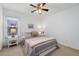 Bedroom with natural light features neutral walls, large window, and a ceiling fan at 1031 Ludwick Way, Lawrenceville, GA 30046