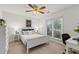 Bedroom with natural light features neutral walls, large window, and a ceiling fan at 1031 Ludwick Way, Lawrenceville, GA 30046