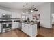 Bright, updated kitchen with stainless appliances, granite countertops, and a breakfast area at 1031 Ludwick Way, Lawrenceville, GA 30046