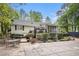 This backyard features a deck and a covered pool, with landscaping surrounding the area at 110 Emerald Dr, Mcdonough, GA 30253