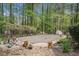 Secluded backyard with a covered swimming pool and mature trees, offering a private outdoor space at 110 Emerald Dr, Mcdonough, GA 30253