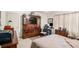 Bedroom with neutral walls and carpet, ceiling fan, and dark-wooden furniture at 110 Emerald Dr, Mcdonough, GA 30253