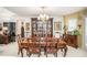 Formal dining room featuring a large dining table set and ornate chandelier at 110 Emerald Dr, Mcdonough, GA 30253