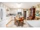 White kitchen with an adjacent breakfast table at 110 Emerald Dr, Mcdonough, GA 30253