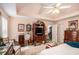 Picture of a main bedroom featuring a tray ceiling with fan and antique furniture at 110 Emerald Dr, Mcdonough, GA 30253